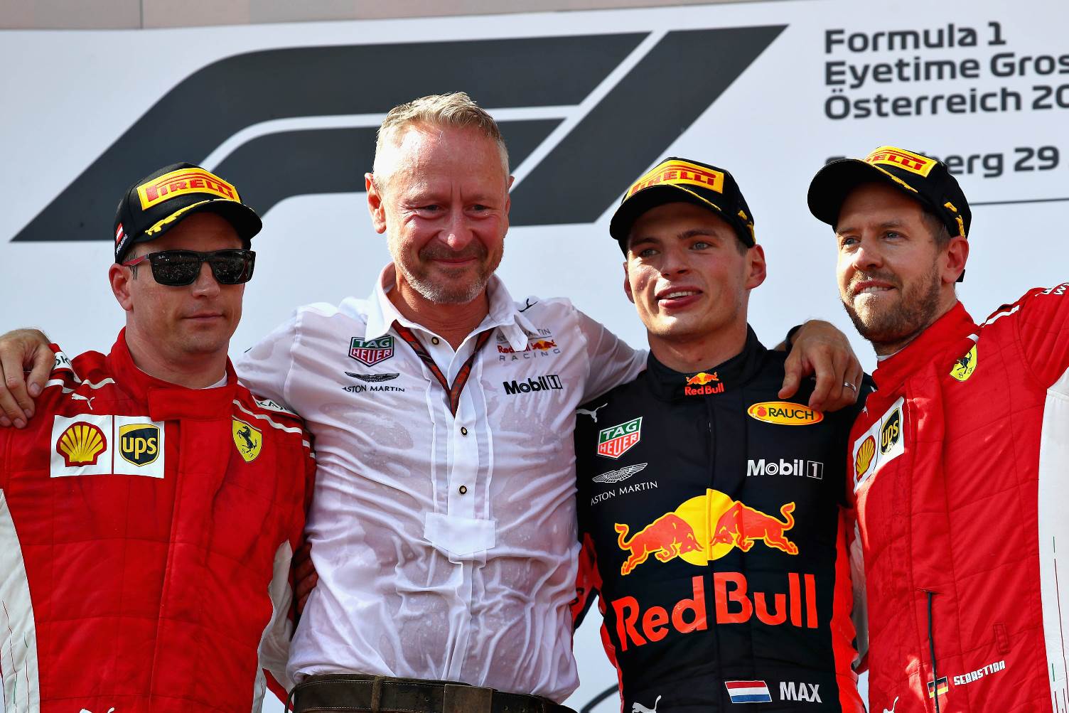 Max Verstappen of Netherlands and Red Bull Racing, Kimi Raikkonen of Finland and Ferrari and Sebastian Vettel of Germany and Ferrari celebrate on the podium with Red Bull Racing Team Manager Jonathan Wheatley during the Formula One Grand Prix of Austria at Red Bull Ring on July 1, 2018 in Spielberg, Austria. (Photo by Mark Thompson/Getty Images) // Getty Images / Red Bull Content Pool // AP-1W54W3VQ91W11 // Usage for editorial use only // Please go to www.redbullcontentpool.com for further information. //